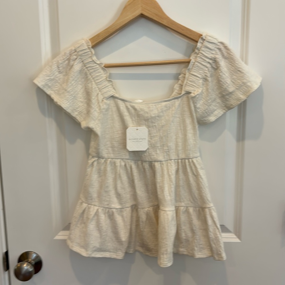Altar’d State cream top with flutter sleeves